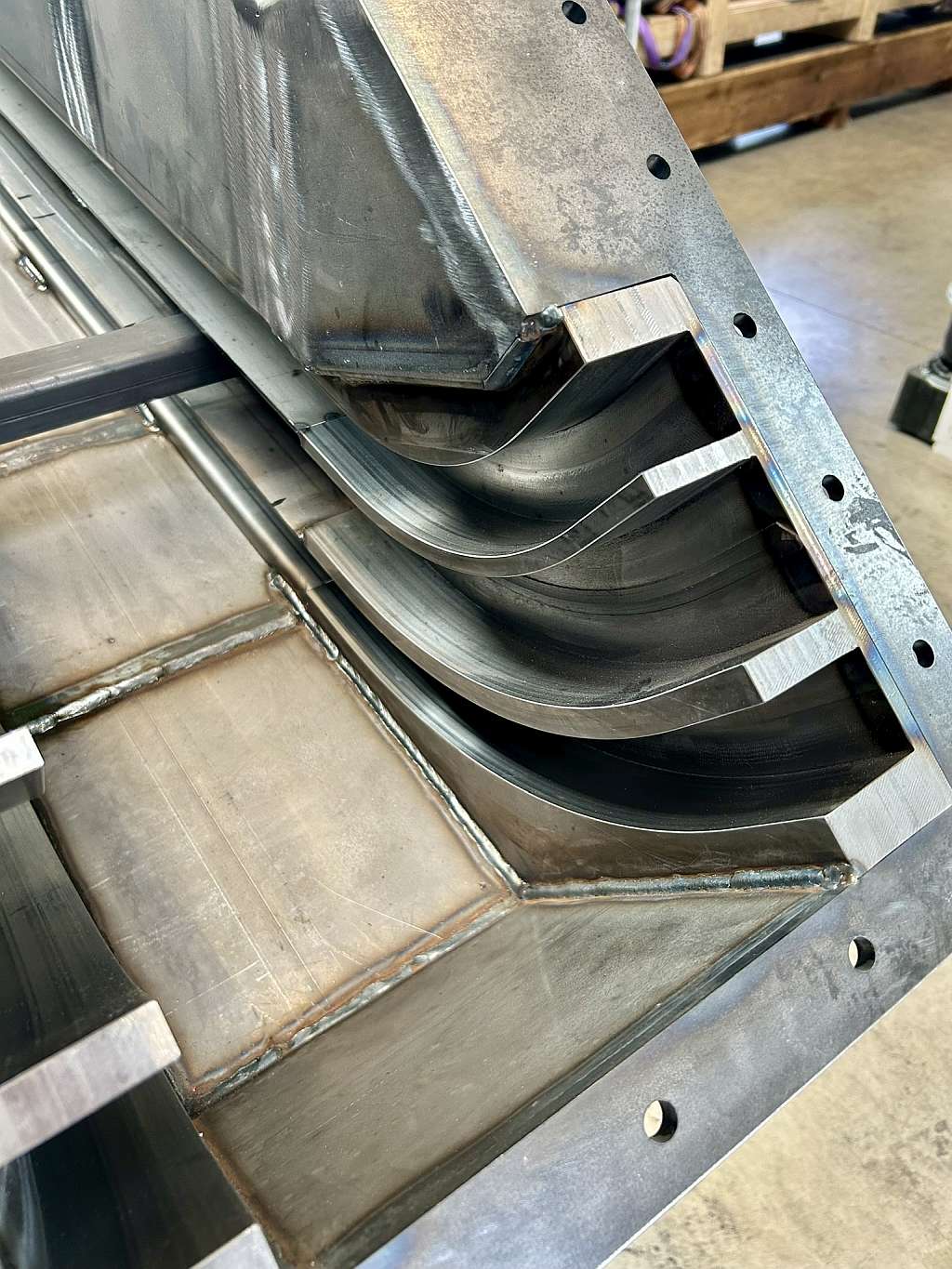 Detailansicht der Umlenktechnik am neu gefertigten Späneförderer von Metaspan